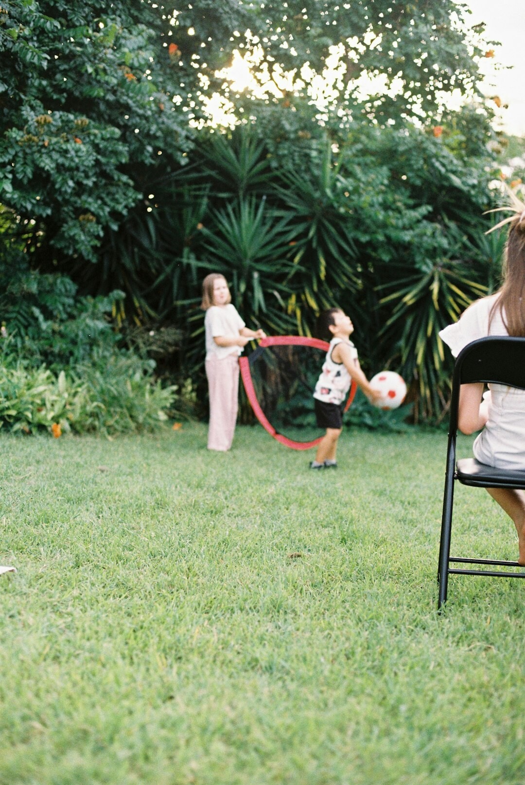 Danish family with two children playing in a garden