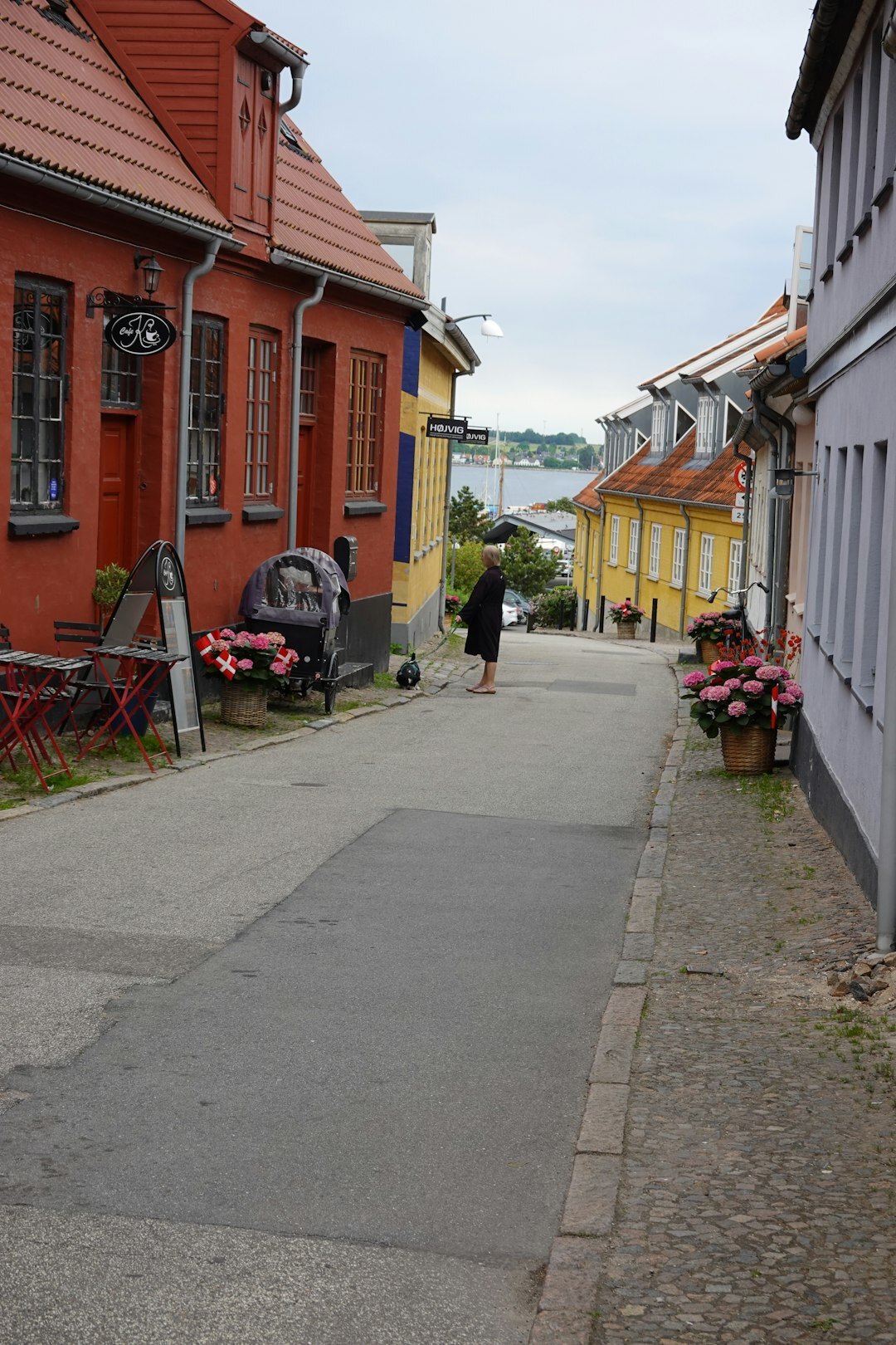 Documentary photo of a narrow street in a Danish coastal town at dusk