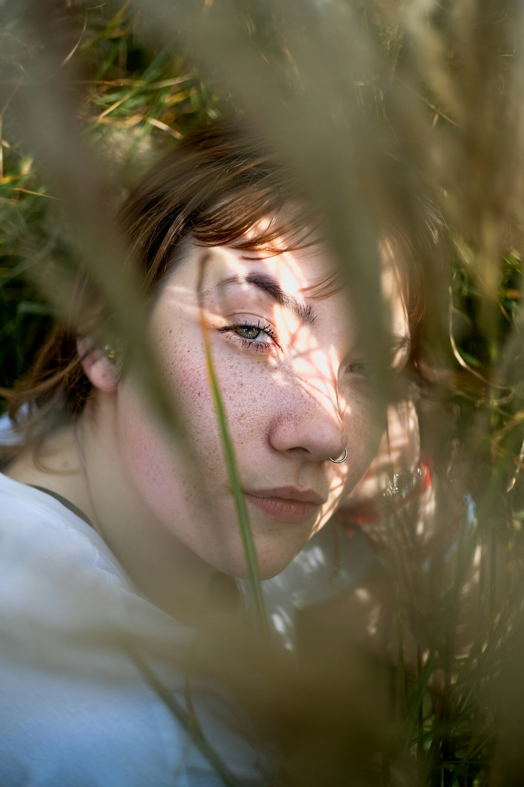 Natural light portrait of a young Danish woman with freckles