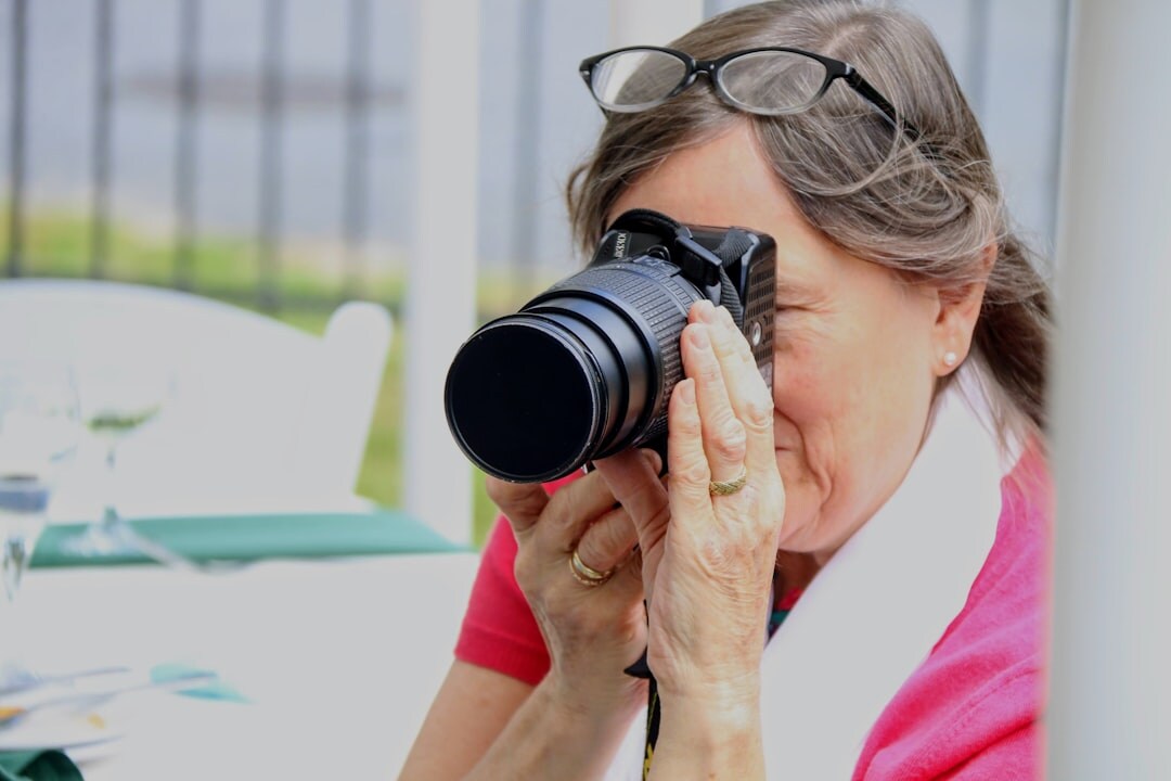 photographer interviewing elderly woman