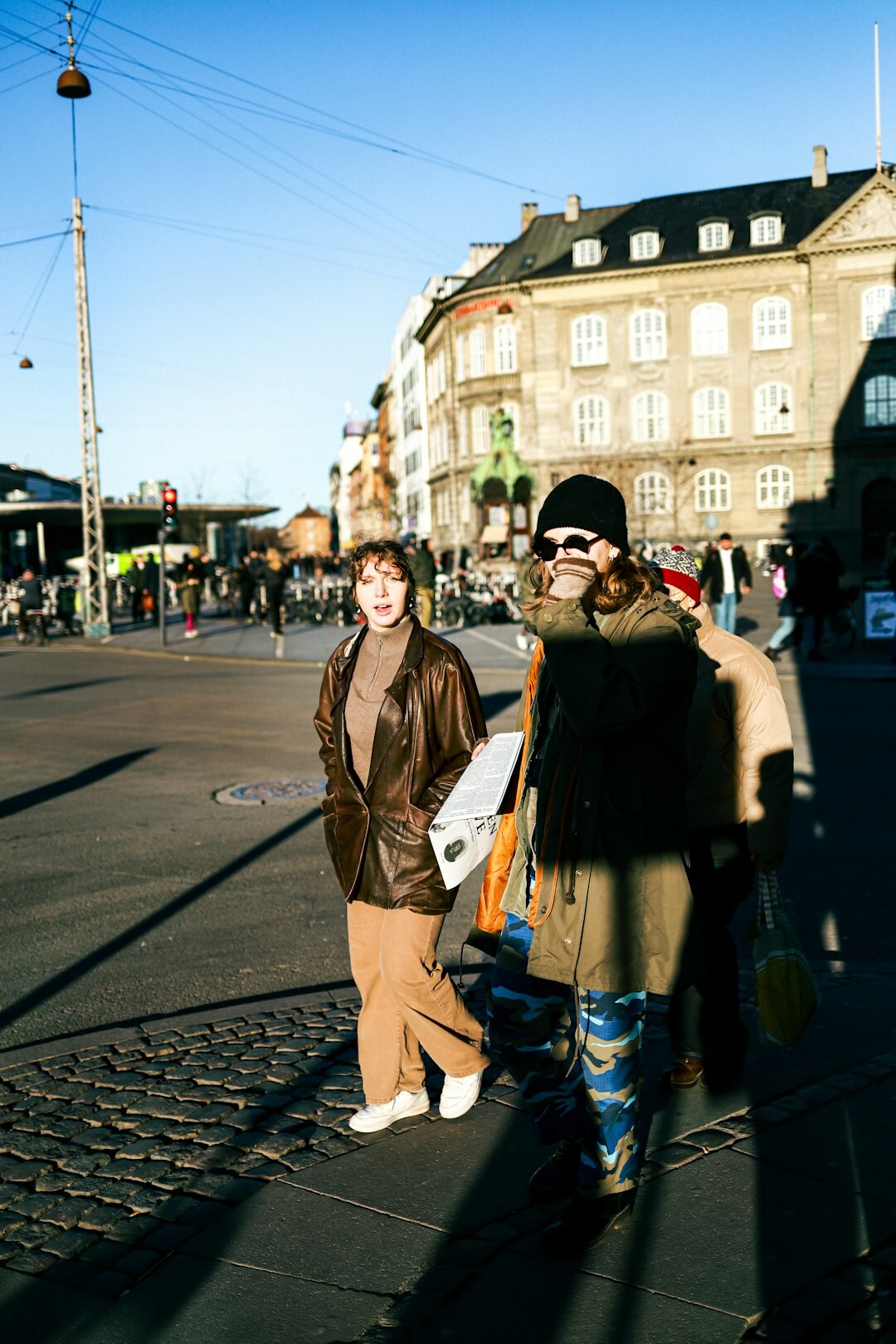 Portrait of a Danish female documentary photographer holding a camera